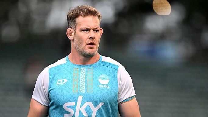 Tom Savage pictured wearing a light blue and white Moana Pasifika shirt. He is looking to his left.