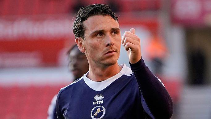 Danny McNamara gives a thumbs up after a game for Millwall