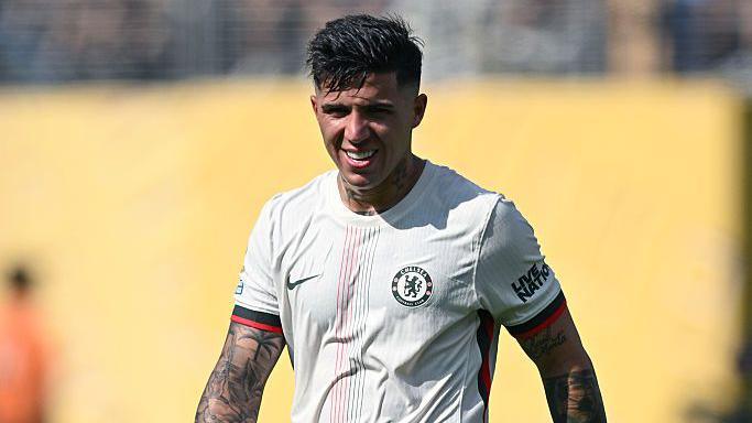 Enzo Fernandez is pictured in action for Chelsea with his shirt stuck to his chest because of all the sweat