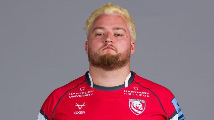 Alfie Petch standing in Gloucester kit