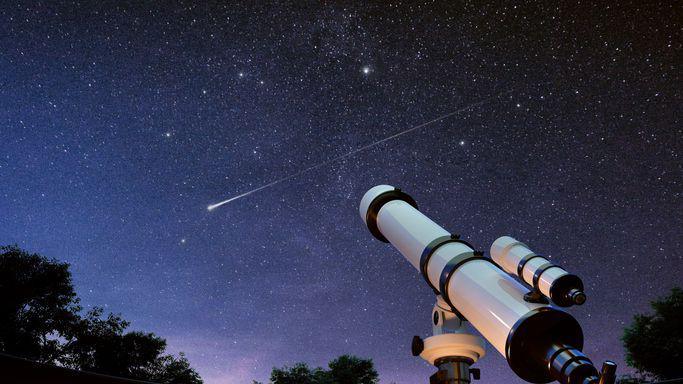 A telescope points at the night sky