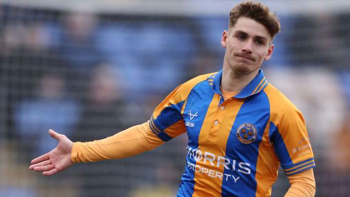George Lloyd of Shrewsbury Town in action during a game