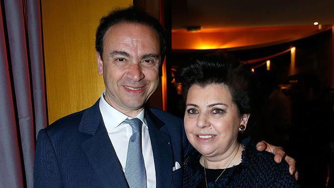Laurent Kraemer has his arm around his wife Nicole as they pose for a photo at an event in 2016.