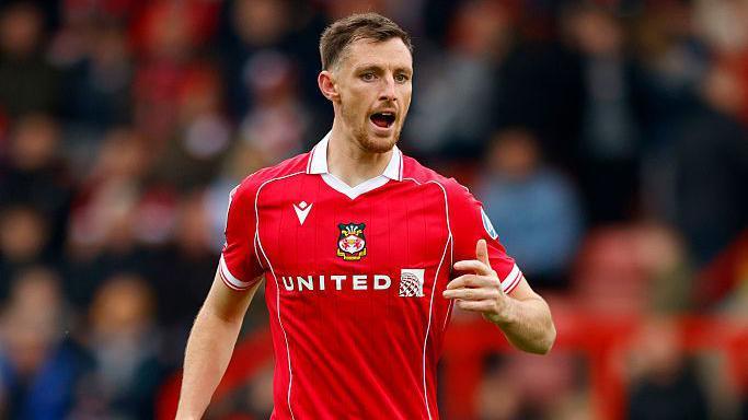 Dom Hyam shouts during a Wrexham game