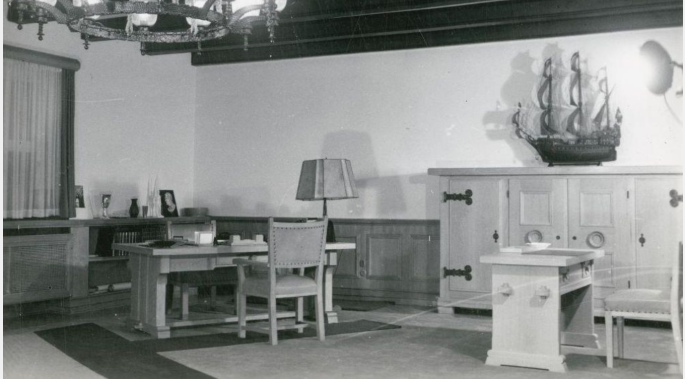 The desk of an SS Comandant of Buchenwald shows a number of things on it, including the lampshade.