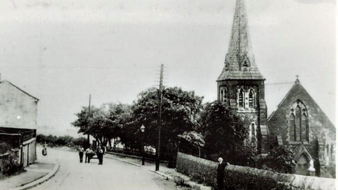 External view of the original church of St Stephen's in Grane Village showing a horse and cart on the road the day before demolition in 1925.