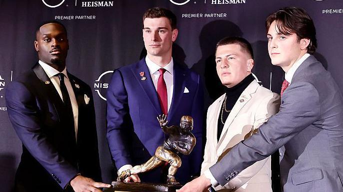 2025 Heisman Trophy finalists Jeremiyah Love, Fernando Mendoza, Diego Pavia and Julian Sayin with the trophy