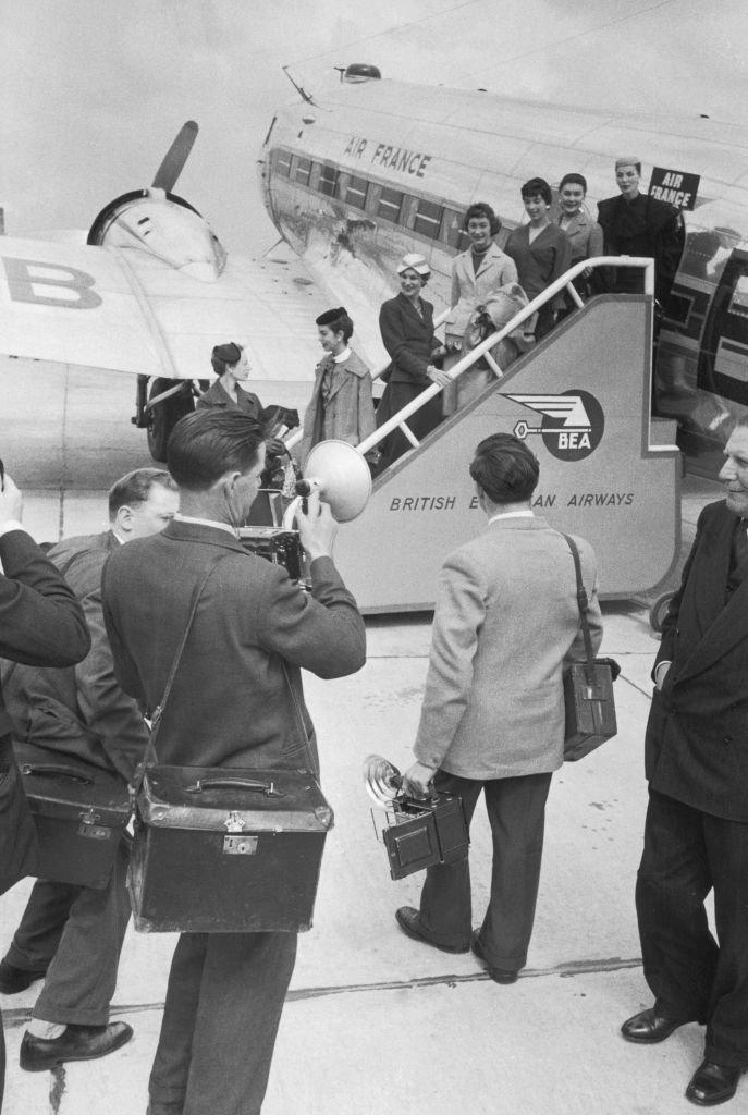 Seven fashion models catch an Air France plane to Scotland to take part in two Christian Dior fashion balls, 21st May 1955. The shows, at Glasgow and Gleneagles, raised £4,000 for the charity Friends of France.