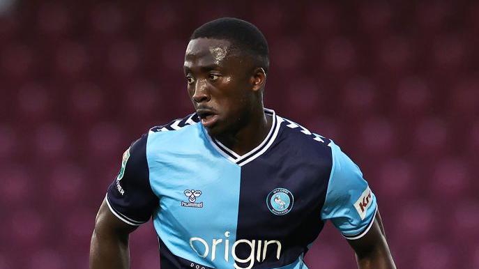 Salford City player Dan Udoh, puctured playing for Wycombe Wanderers.