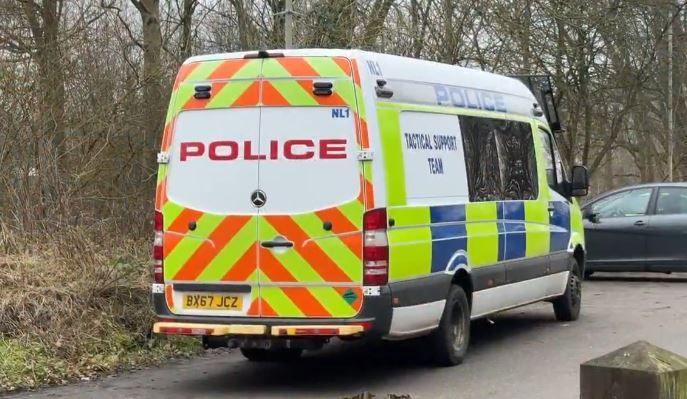 A police van with the words 'Tactical Support Team' on the side.