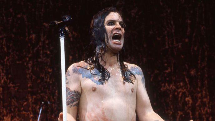 A damp Osbourne on stage with no top