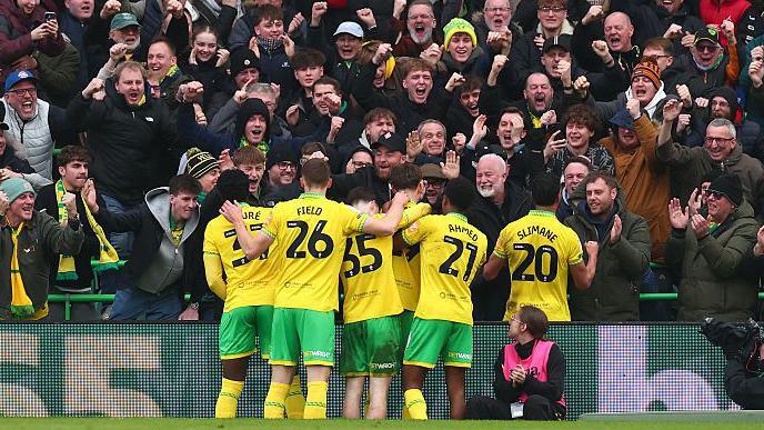 Norwich City players celebrate with the fans during their win over Blackburn Rovers