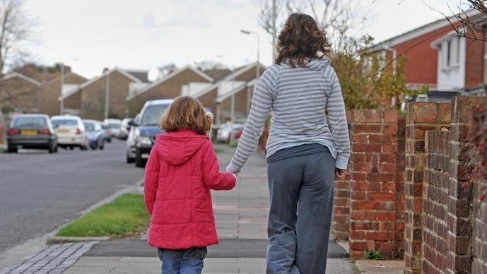 A family walking down the street