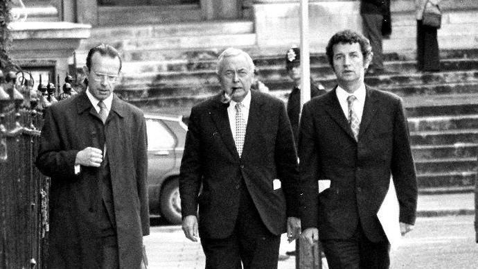 Black and white image of Joe Haines, Harold Wilson and Bernard Donoughue (left to right) walking down the street in the 1970s