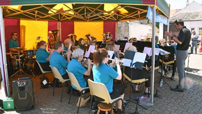 The brass band performing in the open