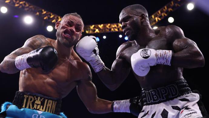 Ishmael Davis (right) lads a punch on Troy Williamson (left) during their fight in Sheffield