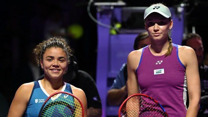 Jasmine Paolini and Elena Rybakina pose together before their match at the 2024 WTA Finals