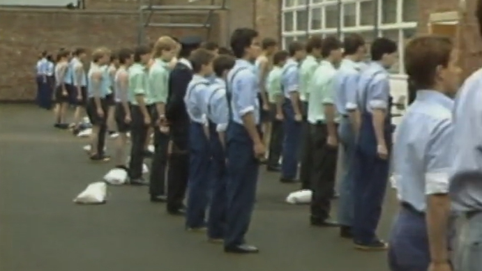 Archive footage of boys lined up in a yard at Eastwood Park.