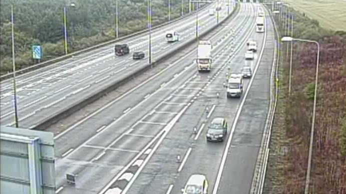 A traffic camera showing cars being led down a slip at junction 29 of the M25