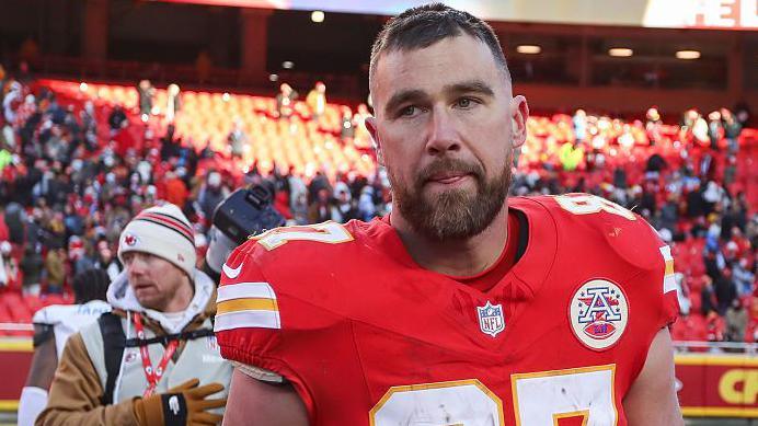 Travis Kelce looks disappointed as he leaves the field following the Kansas City Chiefs' defeat to the Los Angeles Chargers
