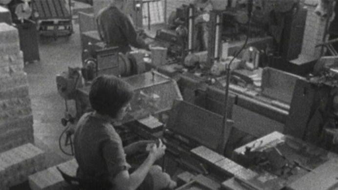 Woman works at a conveyor belt