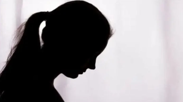 A silhouette of a person suffering domestic violence. 