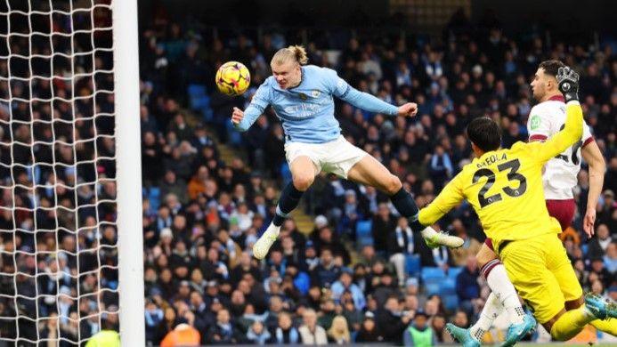 Manchester City striker Erling Haaland heads his side's second in the victory against West Ham