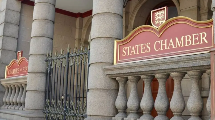 Outside of the States Chamber. A large stone building with 'States Chamber' written in gold and red.