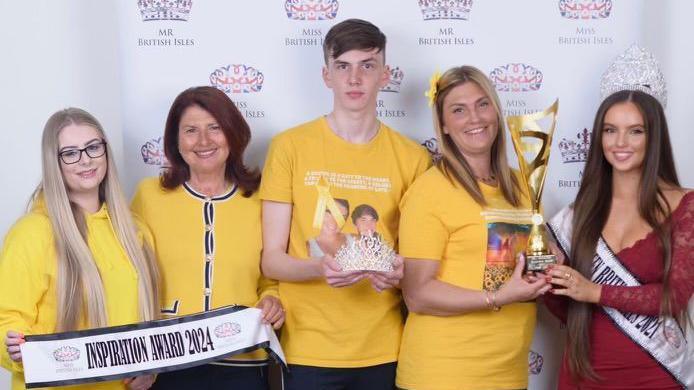 L-R: Leah Smith's best friend, Vikki, her nan, Nina, brother Liam, Jenny Smith and Nina, the Miss British Isles winner