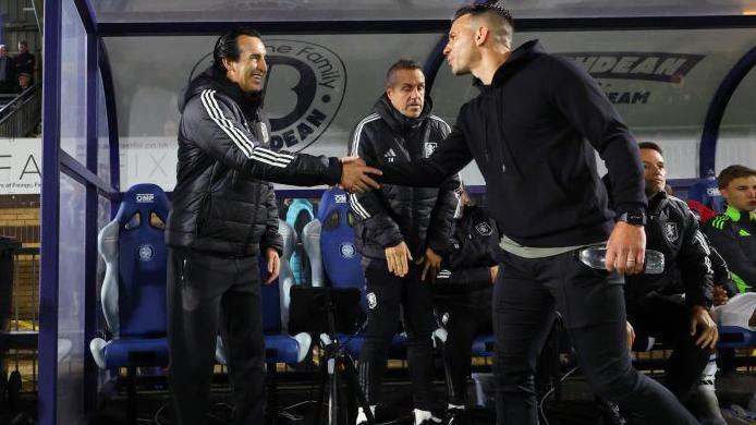 Wycombe boss Matt Bloomfield shakes hands with Aston Villa manager Unai Emery before their EFL Cup third round match in September