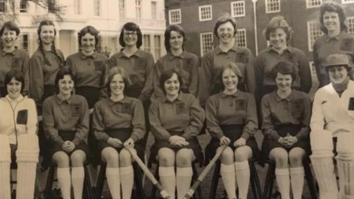 Archive photo of Welsh School Girls hockey team in 1977. Twin sisters Jan and Jean are pictured in the centre of the front row holding hockey sticks. 