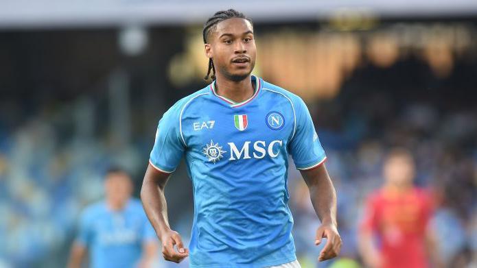 Jens Cajuste wearing Napoli's blue and white kit during a match