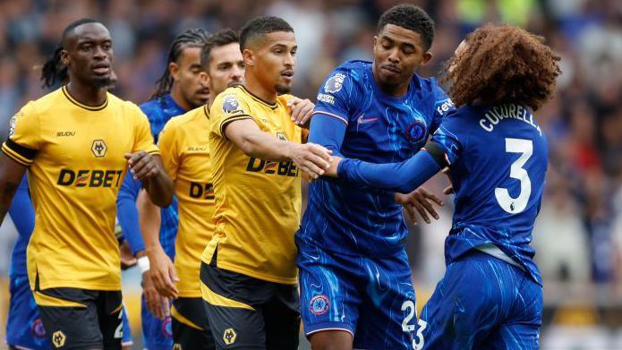 Wesley Fofana and Marc Cucurella are involved in an argument with multiple Wolves players