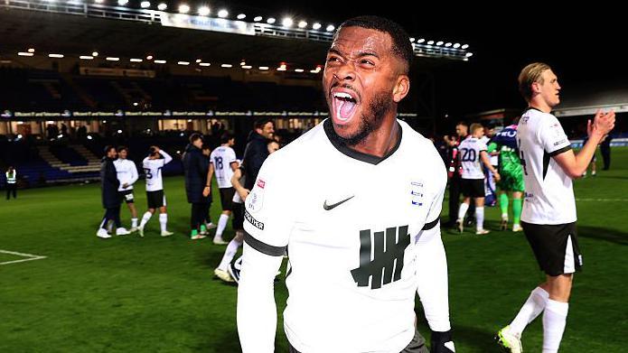 Ethan Laird shouts in delight as Birmingham City celebrate promotion
