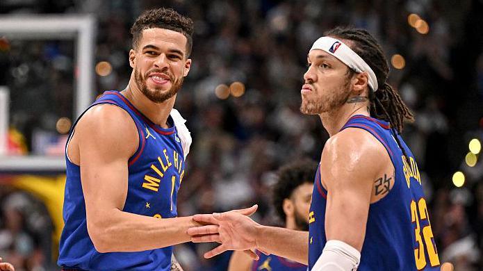 Michael Porter Jr and Aaron Gordon celebrate during the Denver Nuggets'
113-104 play-off win over the Oklahoma City Thunder