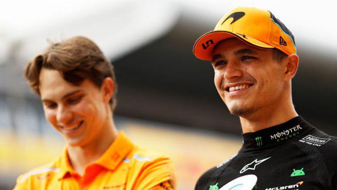 Lando Norris of Great Britain and McLaren smiles with team mate Oscar Piastri of Australia