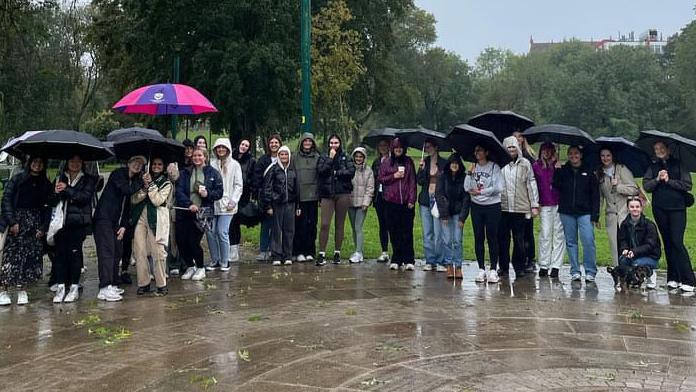 Group of girls with umbrellas