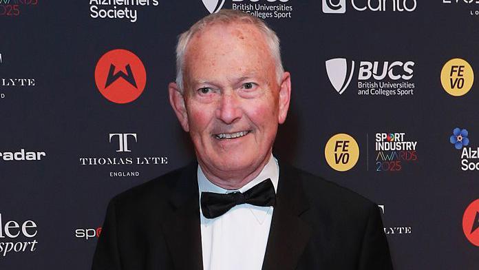 A photograph of a smiling Richard Scudamore