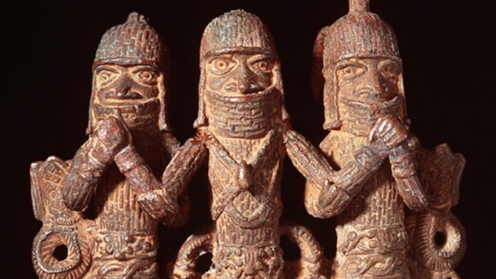 A Benin Bronze sculpture of three people 