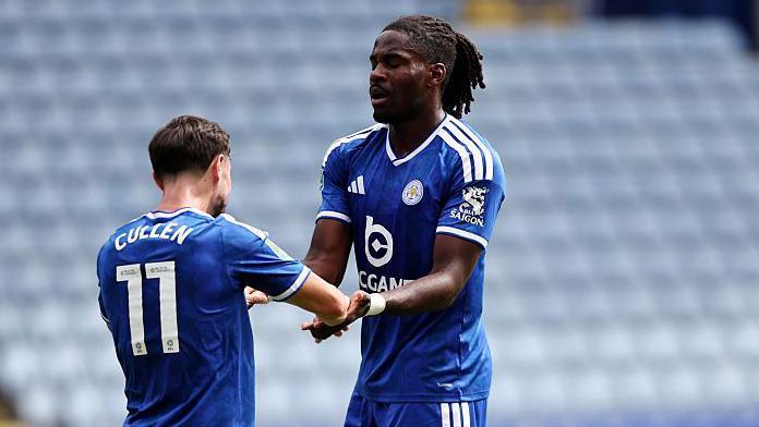 Leicester City defender Caleb Okoli celebrates with new signing Liam Cullen