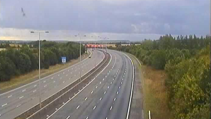 The A1M near Alconbury Hill showing a three lane southbound carriageway empty of traffic after a serious collision