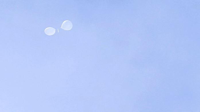 A balloon carrying waste, presumably sent by North Korea, is spotted floating over the presidential office. 