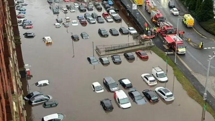 The flooded car park at a block of flat in Stockport