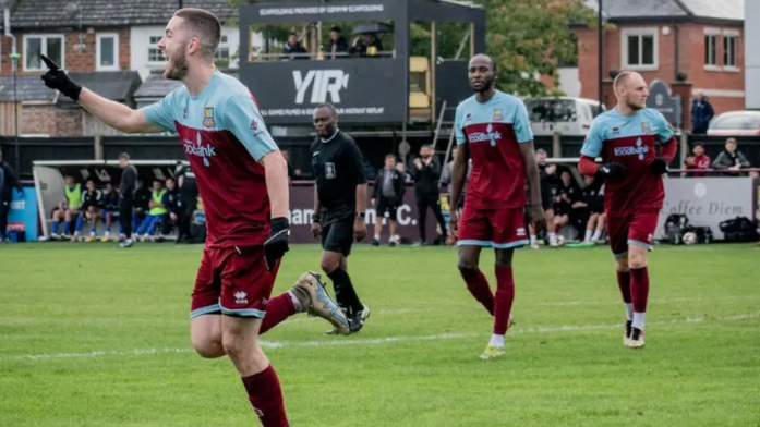 Farnham Town players celebrating a goal