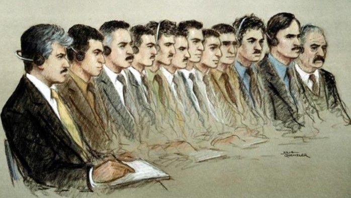 Court sketch shows 12 men, all smartly dressed in jackets, shirts and ties, sitting down. Some are writing in notebooks and some are wearing earphones.