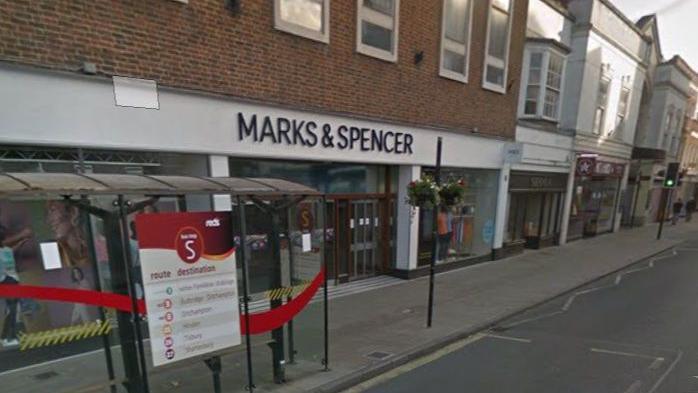 Image of Marks and Spencer in Salisbury. The sign is white with black letters. 