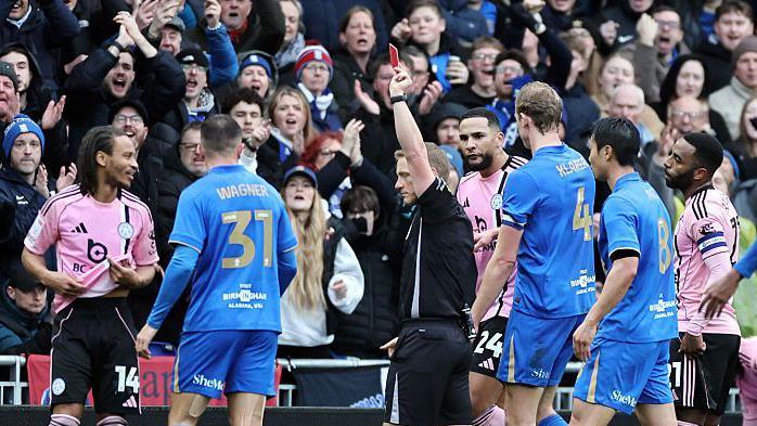 Leicester City midfielder Bobby Decordova-Reid is shown a red card during the defeat at Birmingham City