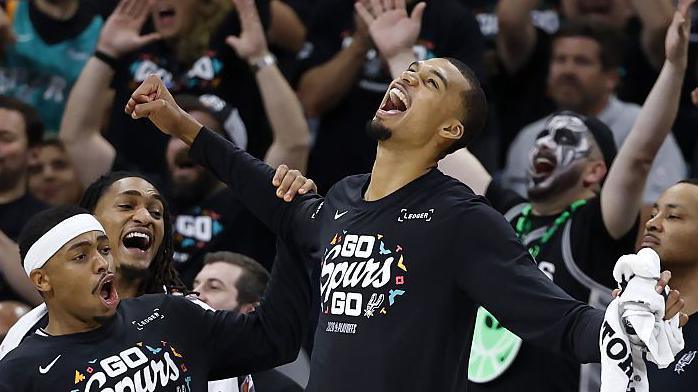 Victor Wembanyama celebrates on the sideline as the San Antonio Spurs beat the Minnesota Timberwolves in game two of their NBA play-off series in May 2026