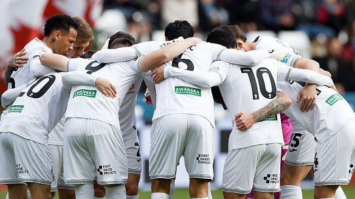 Swansea players in a huddle this season 