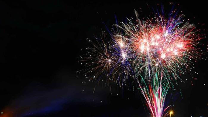 Colourful fireworks against a dark night sky.